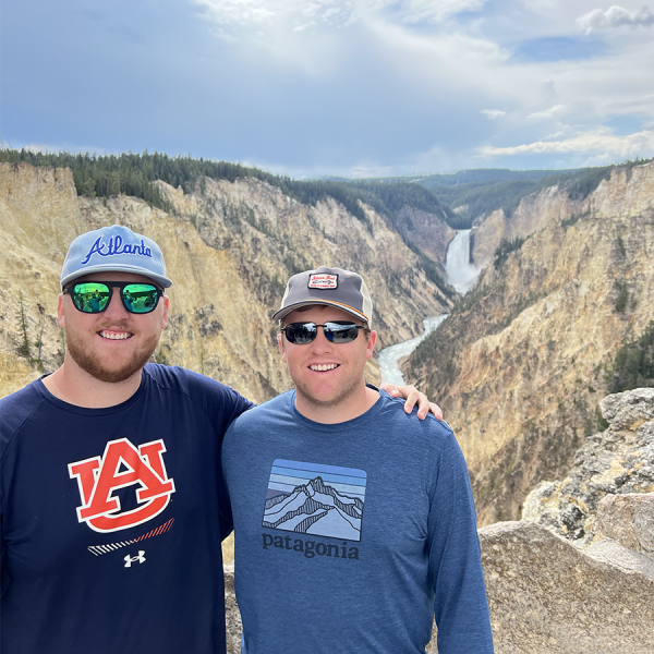 Two brothers pose at Artist Point, Yellowstone Falls. taken on a Teton Excursions tour to Yellowstone National Park
