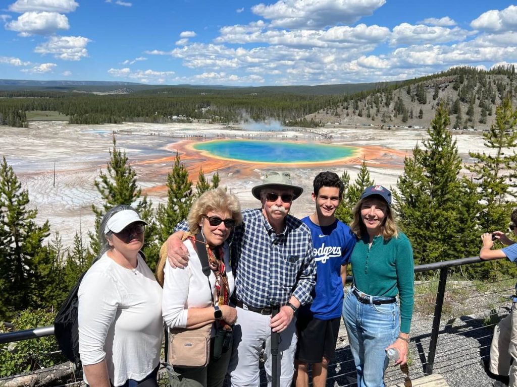 Guests enjoying the view at the Grand Prismatic Overlook during a private Yellowstone tour.