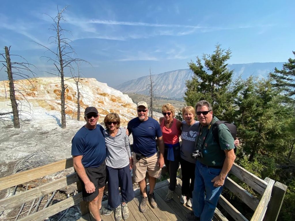 Guests visiting the Mammoth Hot Springs terraces during a private Yellowstone tour.”