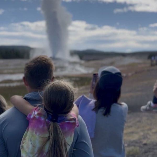 why is Yellowstone National Park important family watching Old Faithful