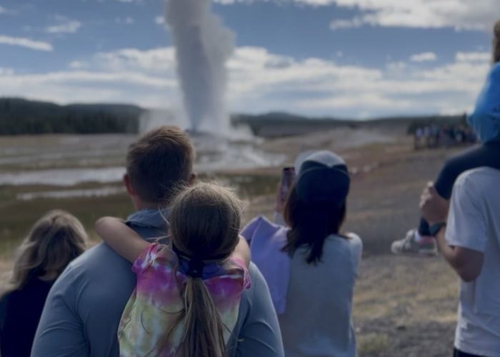 why is Yellowstone National Park important family watching Old Faithful